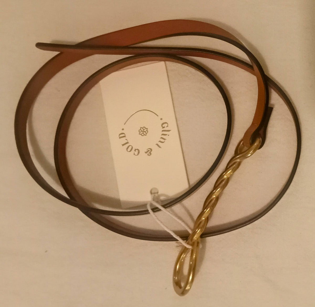 G&G Olivia belt - loosely curled on flat surface