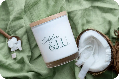 EL cocowax candle, coconut & lime with fresh open raw coconut + measure-of-coconut-wooden-sp 
on.