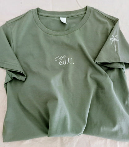 Green t-shirt with 'Ella & Lu' branding on a light background