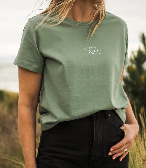 Model wearing EL green T, white Eddie&Lu logo stitiched centre front.