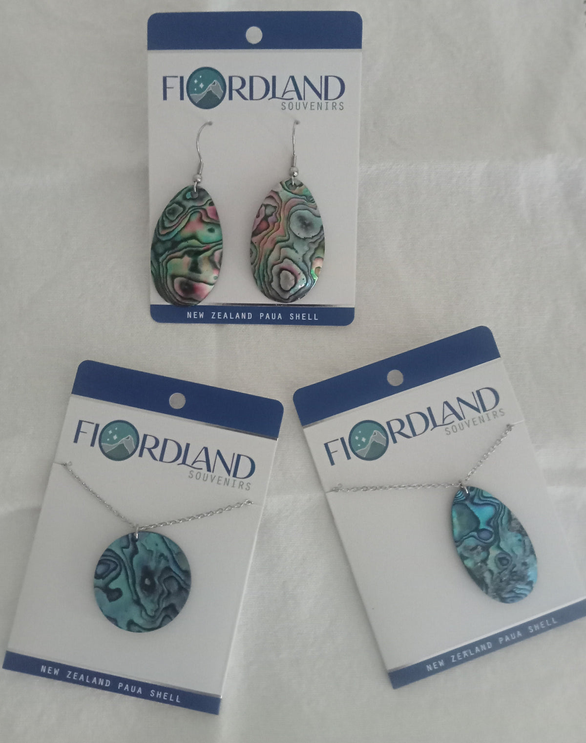 Flordland jewelry set with earrings and necklace on white background